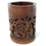 A Chinese carved bamboo brush pot, 19th century, height 17cm, diameter 12cm.
