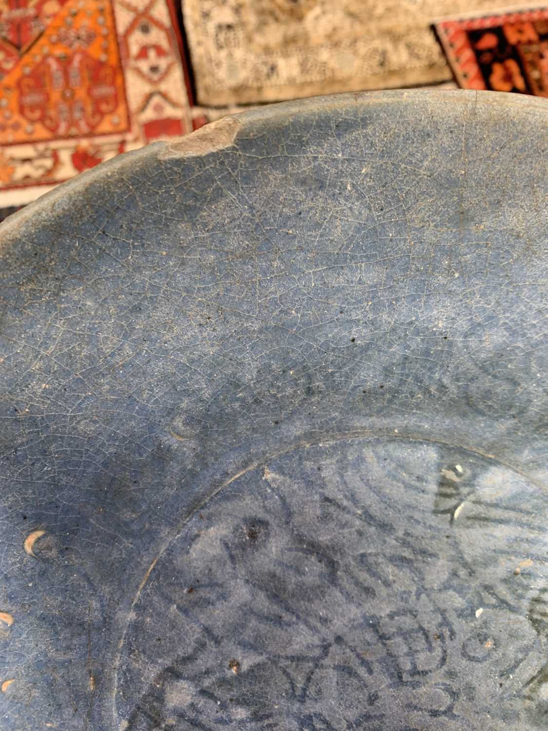 A Chinese Swatow blue glazed dish, late Ming Dynasty, 16th/early 17th century, incised with a - Image 8 of 13