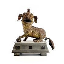 A Chinese gilt metal model of a dog of fo, late Qing Dynasty, height 28cm, width of base 22cm, depth