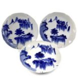 A set of three Japanese Arita blue and white porcelain plates, late 19th century, each decorated