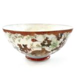 A Japanese Kutani porcelain bowl, early 20th century, character marks, decorated with birds and a