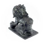 A Chinese bronze of model of a dog of fo, the base. with an apocryphal six-character Xuande mark,