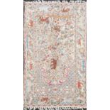 A Kashmir crewel work prayer rug / wall hanging, the mihrab enclosing animals, birds and trees,