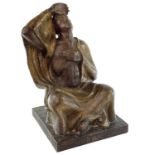 A carved wood figure of a seated Buddhist, signed Franz Wagner 1922, height 48cm, width 29.5cm,