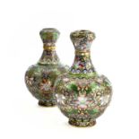 Two similar Chinese champleve gilt metal vases, circa 1900-1920, each with enamelled foliate