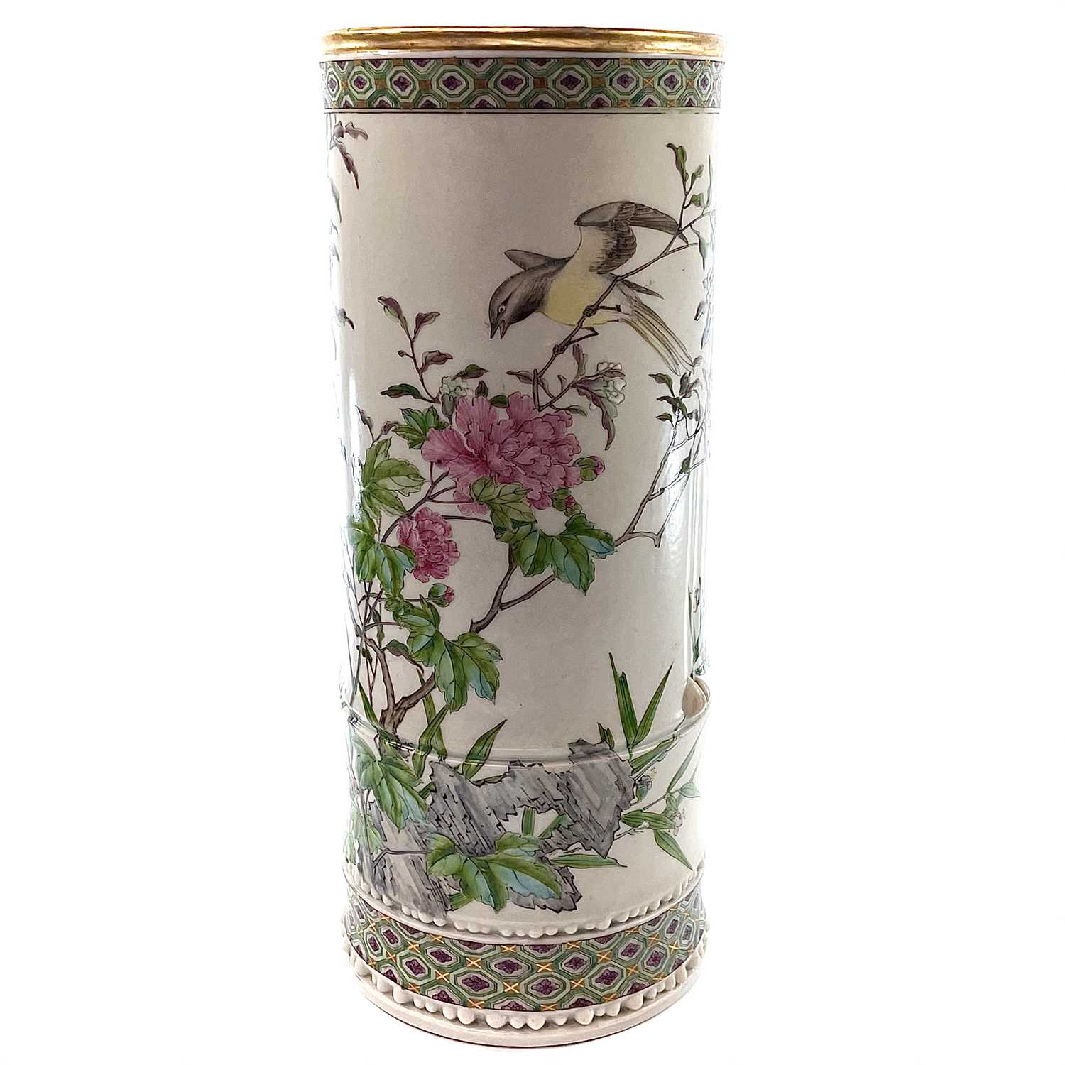 A large Chinese famille rose porcelain brush pot, 19th century, painted with a bird perched on a
