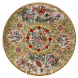 A Chinese Canton famille jaune porcelain plate, 19th century, the yellow ground with a central