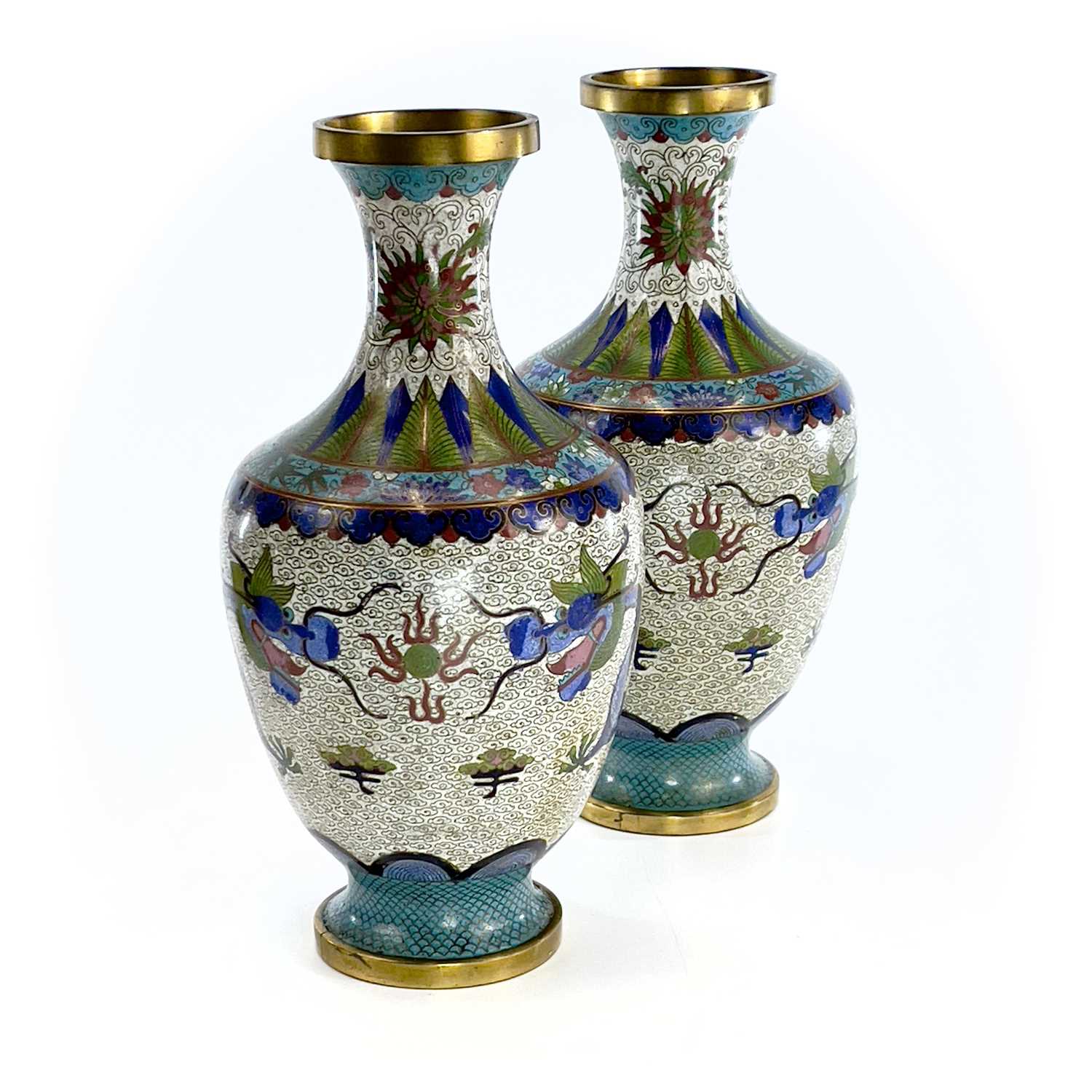A pair of Chinese cloisonne vases, early 20th century, the white ground decorated with dragons