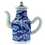 A Chinese blue and white porcelain jug and cover, 18th century, with a stylised dragon and clouds,