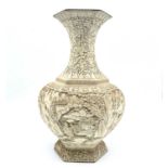 A Chinese white cinnabar lacquer hexagonal vase, early-mid 20th century, the panels decorated with