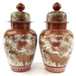A large pair of Japanese Kutani porcelain vases and covers, 19th century, signed, gilt decorated