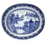 A Chinese export blue and white porcelain dish, Qianlong period, the river scene with boats,
