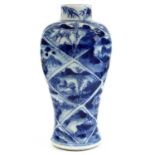 A Chinese blue and white porcelain baluster vase, circa 1800, the trellis ground with river