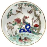 A Chinese famille verte porcelain dish, 19th century, red seal mark, diameter 14.5cm.There is a