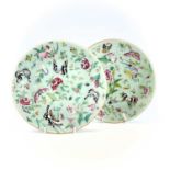 Two Chinese Canton celadon porcelain plates, 19th century, diameters 26.5cm and 25.5cm. (2)One has a