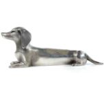 A Japanese silver model of a dashchund, signed, height 6cm, length 16cm, width 3cm, 326 grams.the