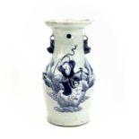 A Chinese celadon vase, 19th century, decorated in blue and white with a figure tempting the feng