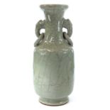 A Chinese celadon crackle glaze vase, with elephant mask handles, height 23cm, width 9.5cm.Good