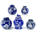 Five Chinese blue and white prunus pattern porcelain jars and covers, 20th century, height of