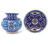 A Moroccan pottery dish, circa 1900, diameter 17cm and a Sind pottery vase, late 19th century, of