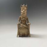 A Benin bronze model of a seated chief, height 28.5cm, width 11cm