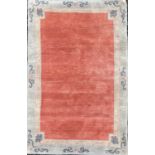 A contemporary Tibetan rug, the plain red field within two borders, 183 x 120cm.pile is good. Couple