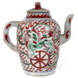 A Chinese porcelain teapot, 18th century, decorated with red and green dogs of fo, height 14.5cm,