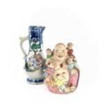 A Chinese famille rose porcelain jug, 18th century, height 14.5cm, width 7.5cm and a Chinese