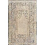 A Ghiordes prayer rug, West Anatolia, circa 1900, the mihrab filled with rows of small