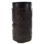 A Chinese carved bamboo brush pot, carved with a river scene and mountainous landscape, height 17cm,