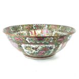 A large Chinese Canton punch bowl, circa 1910, with numerous panels enclosing figures, birds,