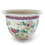 A Chinese famille rose porcelain jardiniere, decorated with foliage and insects, height 16cm,