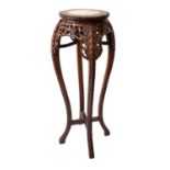 A Chinese carved hardwood marble top vase stand, late 19th/early 20th century, height 90cm, diameter
