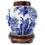A Chinese blue and white porcelain jar, 19th century, decorated with floral sprays and rocky