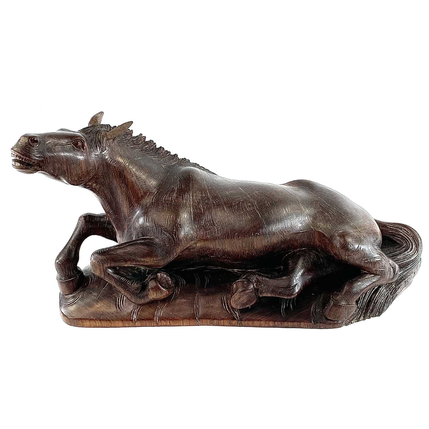 A Chinese carved wood model of a horse, 19th century, on a later base, height 20cm, width 38cm,