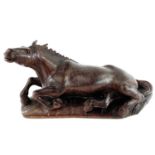 A Chinese carved wood model of a horse, 19th century, on a later base, height 20cm, width 38cm,