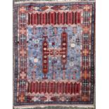 A Turkish carpet, the light blue field with a central medallion enclosing guls, animals and