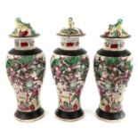 Three Chinese crackle glaze famille baluster vases, circa 1900, each decorated with a carnival