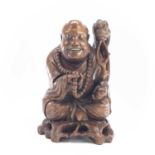 A large Chinese carved wood model of buddah, early 20th century, height 44cm, width 30cm, depth