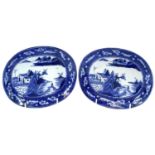 A pair of Chinese porcelain oval dishes, 19th century, each decorated with a river scene within a