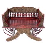 An Indian Howdah chair, with a spindle filled back on a solid seat, height 50cm, width 61.5cm, depth