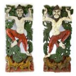 A pair of Chinese painted carved wood panels, early-mid 20th century, of figures and foliage above