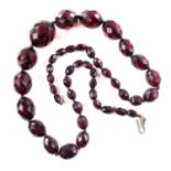 A cherry 'amber' bakelite graduated bead necklace, length 62cm, 51 grams.