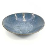 A Chinese Swatow blue glazed dish, late Ming Dynasty, 16th/early 17th century, incised with a
