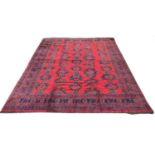 An Ushak carpet, West Anatolia, circa 1920, the madder field with five rows of seven medallions, 465