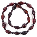 A Chinese cherry 'amber' bakelite bead necklace, signed, 78 grams. length 75cm.