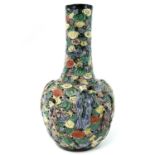 A Chinese famille verte reticulated bottle vase, 19th century, the neck carved in relief with