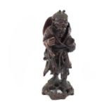 A Chinese carved hardwood figure of a bearded man, late 19th century, height 31.5cm, width 12cm.