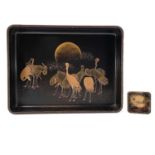 A Japanese black and gilt lacquered tray, decorated with cranes, height 5cm, width 32cm, depth 24.
