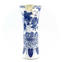 A Chinese blue and white beaker vase, Gu, Transitional, 17th century, painted with figures in a